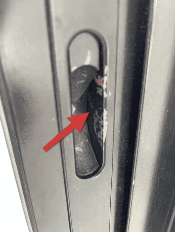 Inspector testing window frames and seals